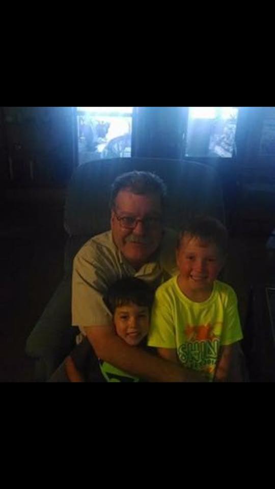 This image has an empty alt attribute; its file name is dad-with-nephews.jpg